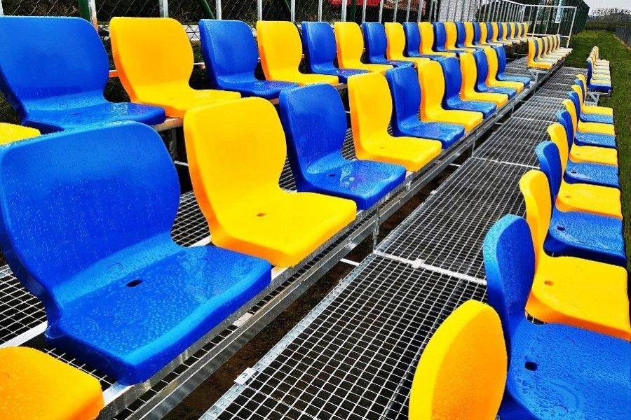 bleachers with blue and yellow ergonomic sports chairs for spectators type WO-07 ProStar