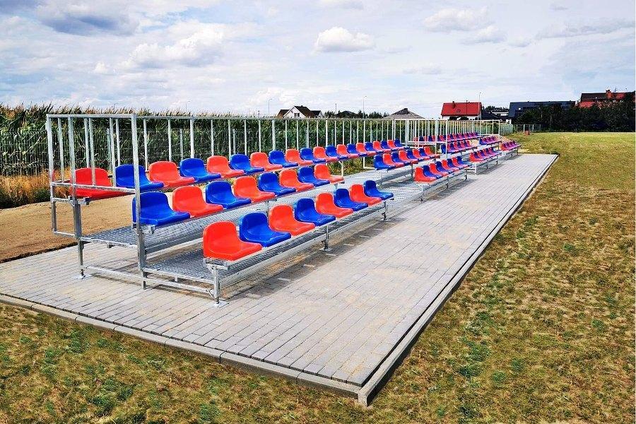 three-row football stadium stands with colorful stadium chairs