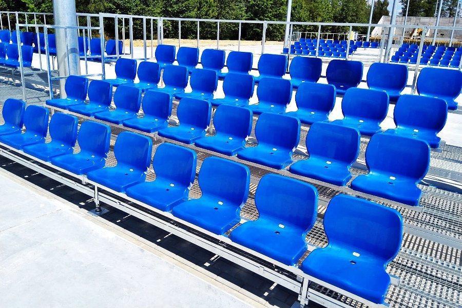 Metal tribune with ergonomic plastic chairs for spectators for sports events and shows - manufacturer