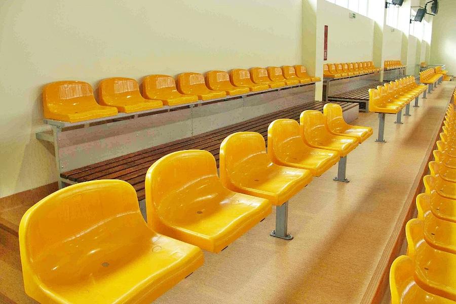 comfortable stadium seats with medium backrest - yellow - on a metal structure