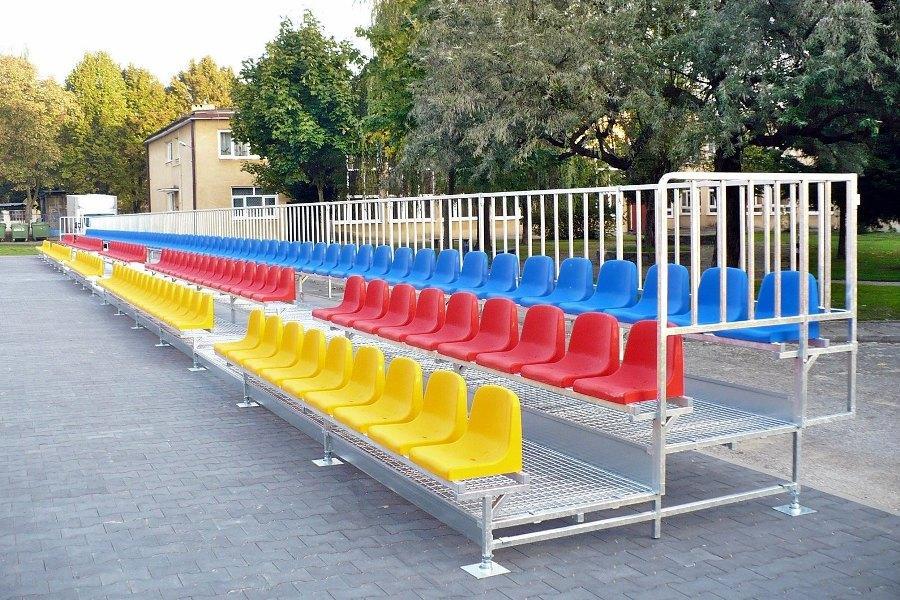 three-row metal bleachers with plastic chairs for school playgrounds